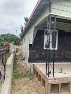 Re-stucco over wood siding